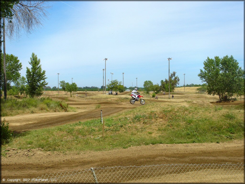 Honda CRF Motorcycle jumping at Riverfront MX Park Track