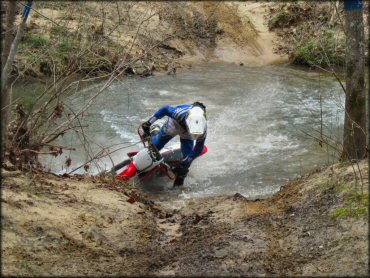 Honda CRF Motorcycle in the water at Sandtown Ranch OHV Area