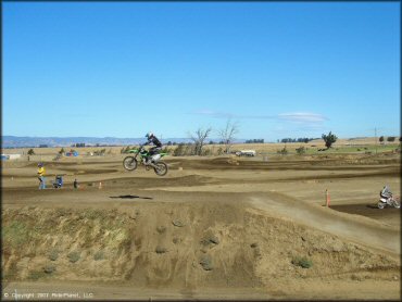 Kawasaki KX Dirtbike jumping at Argyll MX Park Track