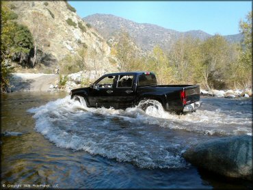 four by four traversing the water at San Gabriel Canyon OHV Area