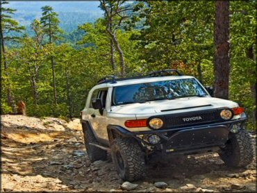 Toyota 4Runner navigating some rocks.