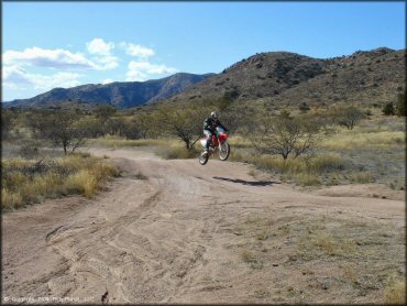 Honda CRF Dirt Bike jumping at Redington Pass Trail