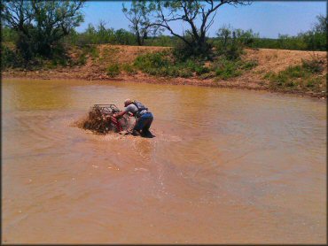 OHV in the water at Mudualistic ATV Park OHV Area