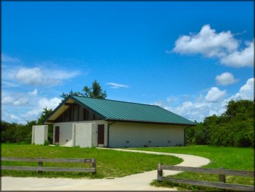 Large bathhouse with flush toilets and hot showers.