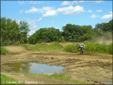Motorbike doing a wheelie at Connecticut River MX Track