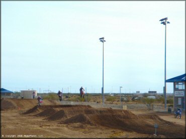 Honda CRF Motorcycle jumping at M.C. Motorsports Park Track
