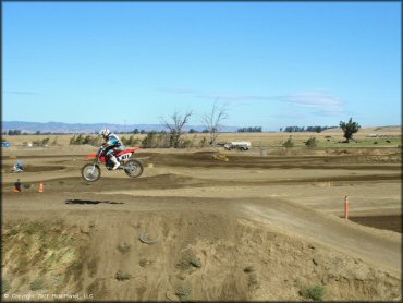 Honda CRF Trail Bike catching some air at Argyll MX Park Track