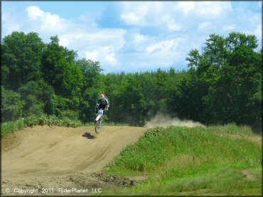 Motorcycle catching some air at Connecticut River MX Track