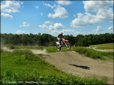 Honda CRF Dirtbike catching some air at Frozen Ocean Motorsports Complex Track