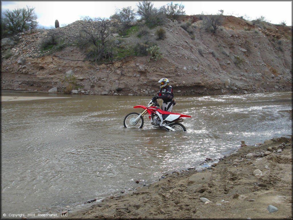 Honda CRF Trail Bike getting wet at Black Hills Box Canyon Trail