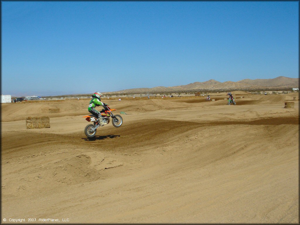 KTM Motorcycle catching some air at Cal City MX Park OHV Area