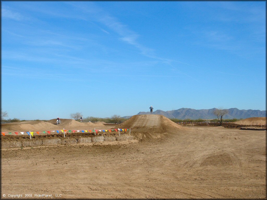 Motorcycle getting air at Motoland MX Park Track