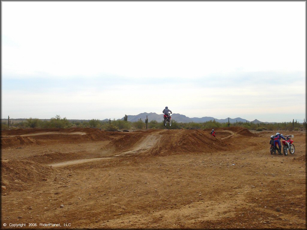 Honda CRF Motorcycle getting air at Canyon Motocross OHV Area
