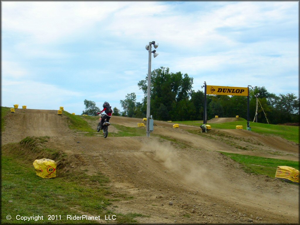 KTM Dirt Bike getting air at Area 51 Motocross OHV Area