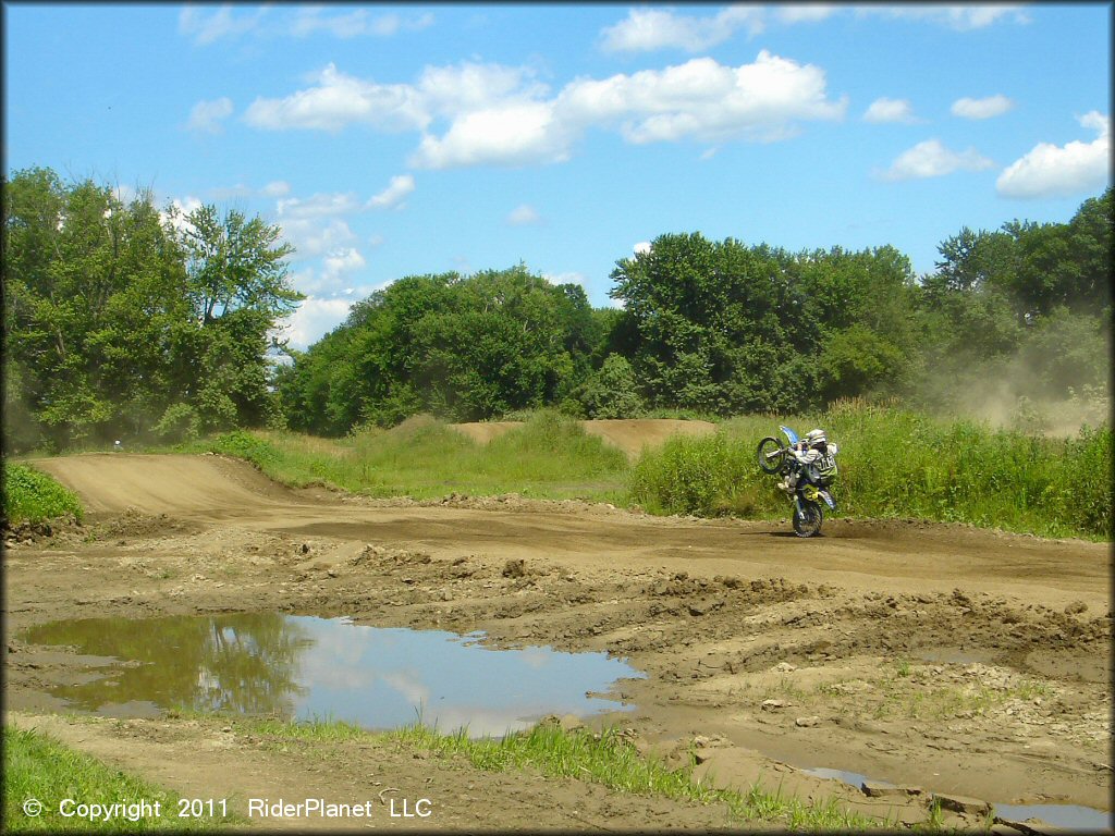 Motorcycle doing a wheelie at Connecticut River MX Track