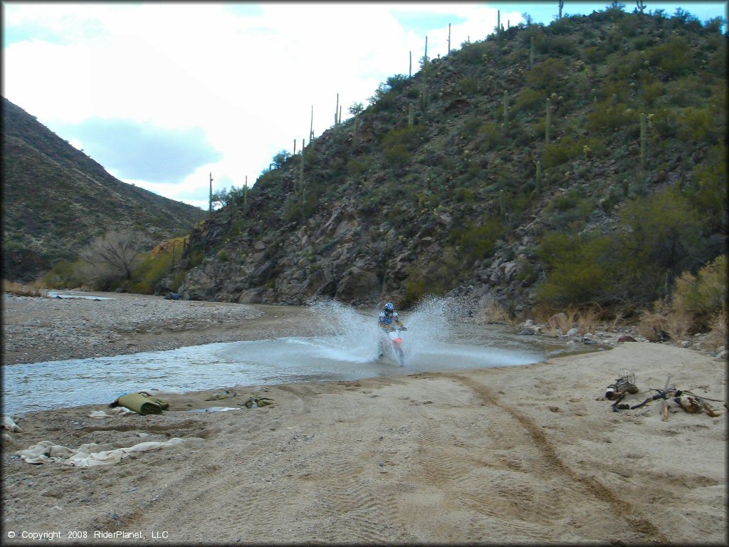 Honda CRF Off-Road Bike in the water at Black Hills Box Canyon Trail