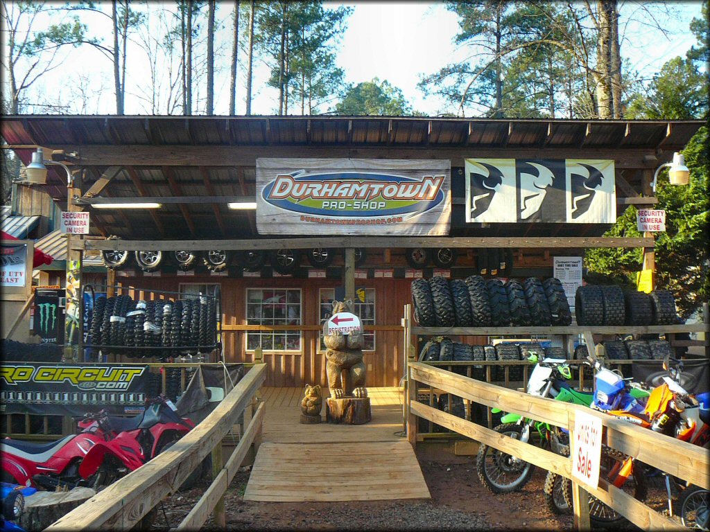 Outdoor photo of pro shop with ATV and dirt bike units for sale and rent.