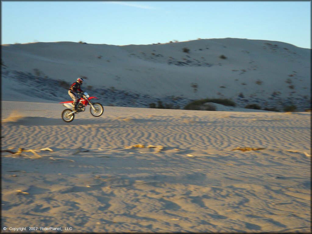 Honda CRF Dirt Bike doing a wheelie at Rasor OHV Area