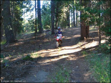 Girl riding a Honda CRF Dirt Bike at Pilot Creek OHV Trails
