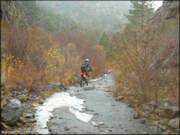 Honda CRF Motorcycle traversing the water at Leviathan Recreation Area Trail