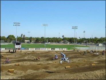 Yamaha YZ Motorcycle jumping at Los Banos Fairgrounds County Park Track
