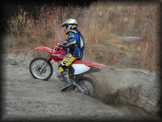 Dirt Bike Rider In Sand