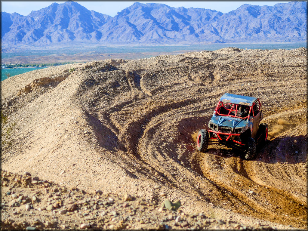 Hailey Hein rounds an off camber turn in her Polaris RZR 570