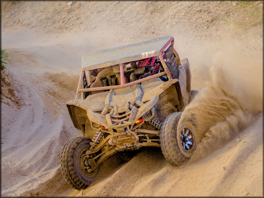 Robert Olander blasts through a sand corner in his YXZ 1000r