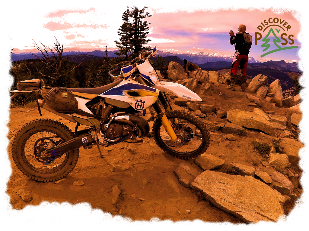 Husqvarna Motorcycle and Rider On Scenic MountainTop in Washington