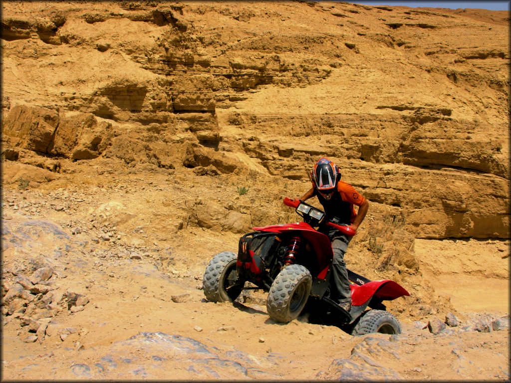 Polaris ATV Navigating a Rocky Trail