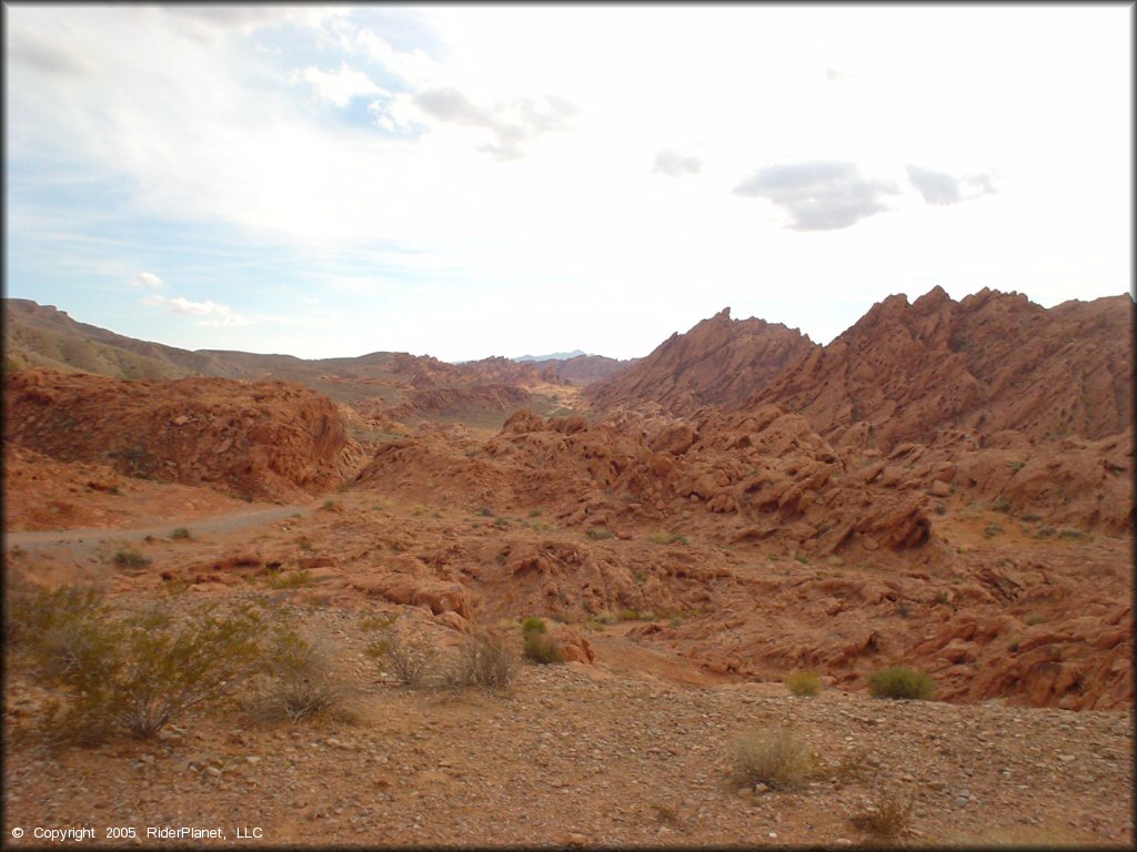 Scenic view of reddish orange rock formations at Logandale Trails.