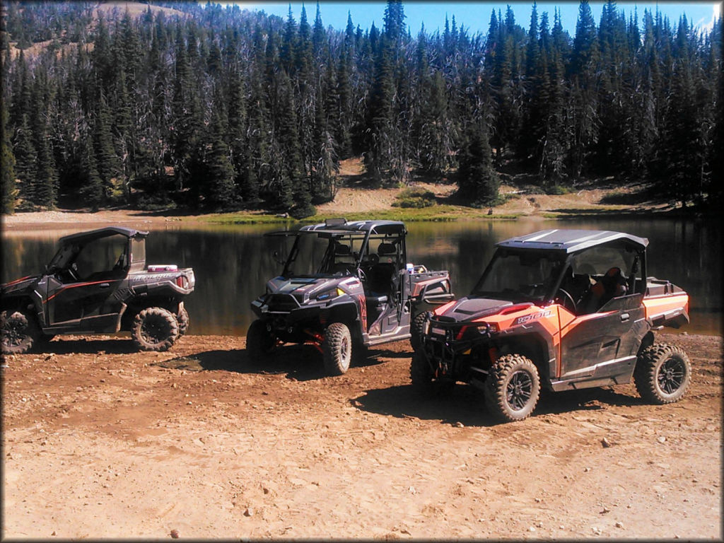 Group of UTVs parked next to small lake at the Ahtanum State Forest.