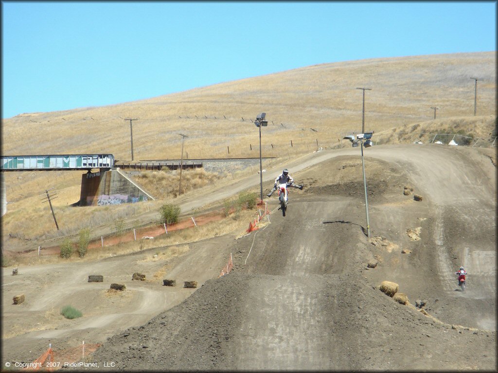 Motocross rider catching some big air at Club Moto.