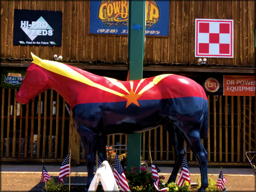 Statue of Horse Painted As Colorado Flag
