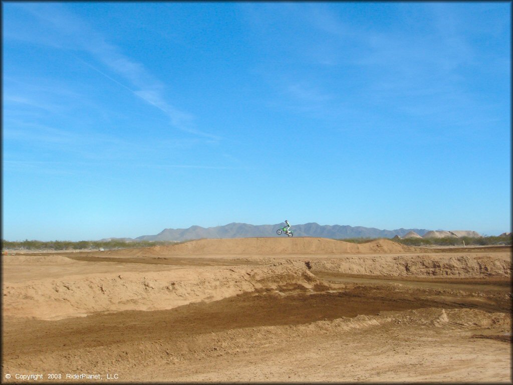 Kawasaki KX Dirt Bike jumping at Motoland MX Park Track
