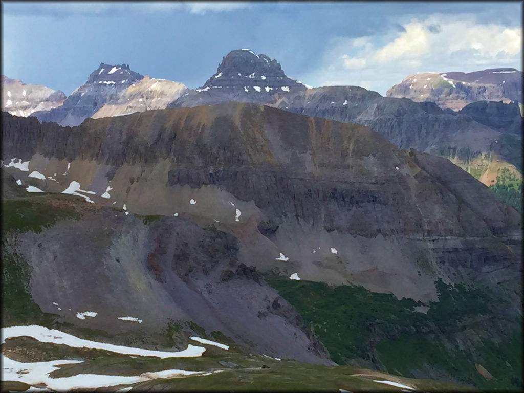 A view of snow-capped mountain peaks in the Rocky Mountains.