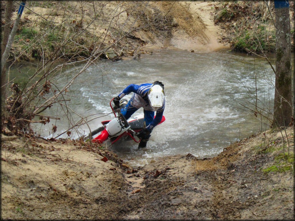 Honda CRF Trail Bike crossing the water at Sandtown Ranch OHV Area