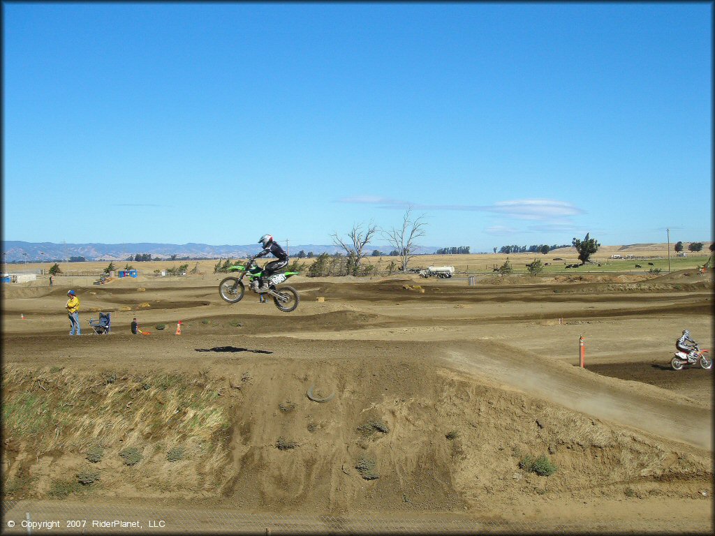 Kawasaki KX Dirt Bike catching some air at Argyll MX Park Track