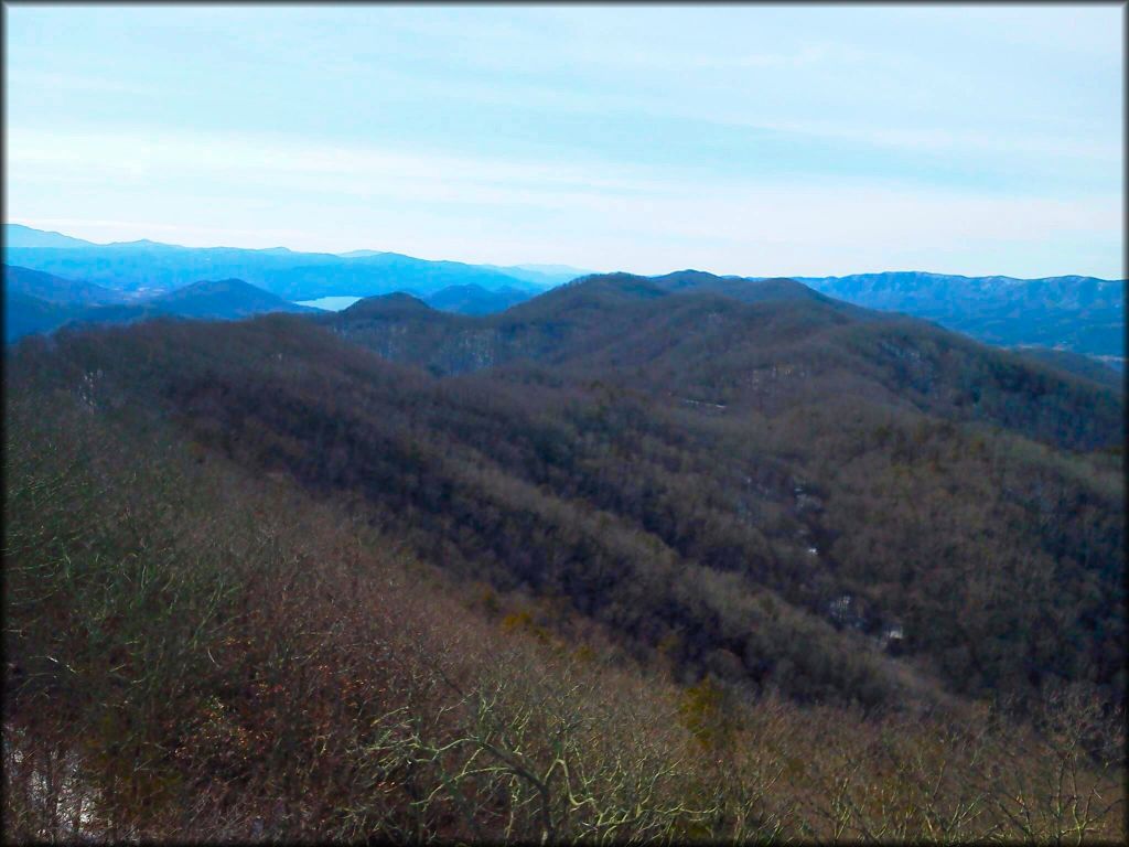 A scenic view of rolling hills and mountains.