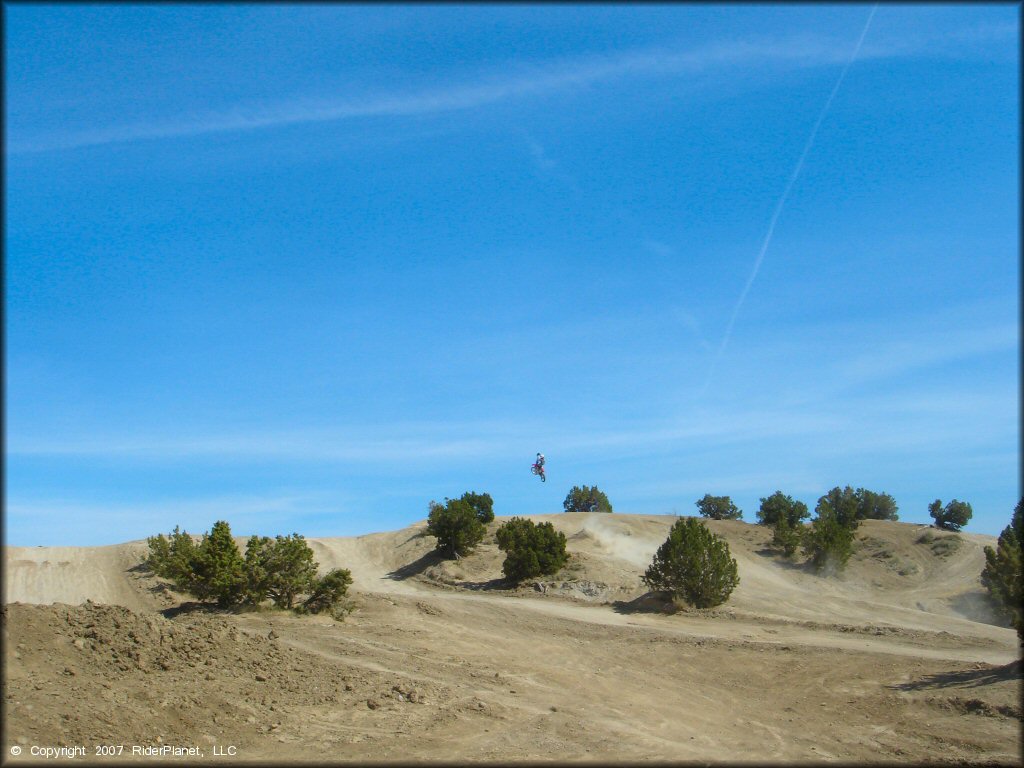 Dirtbike catching some air at Stead MX OHV Area