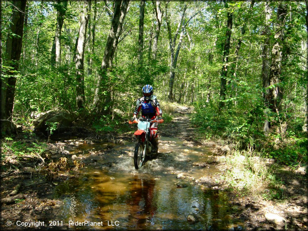 OHV traversing the water at Wrentham Trails