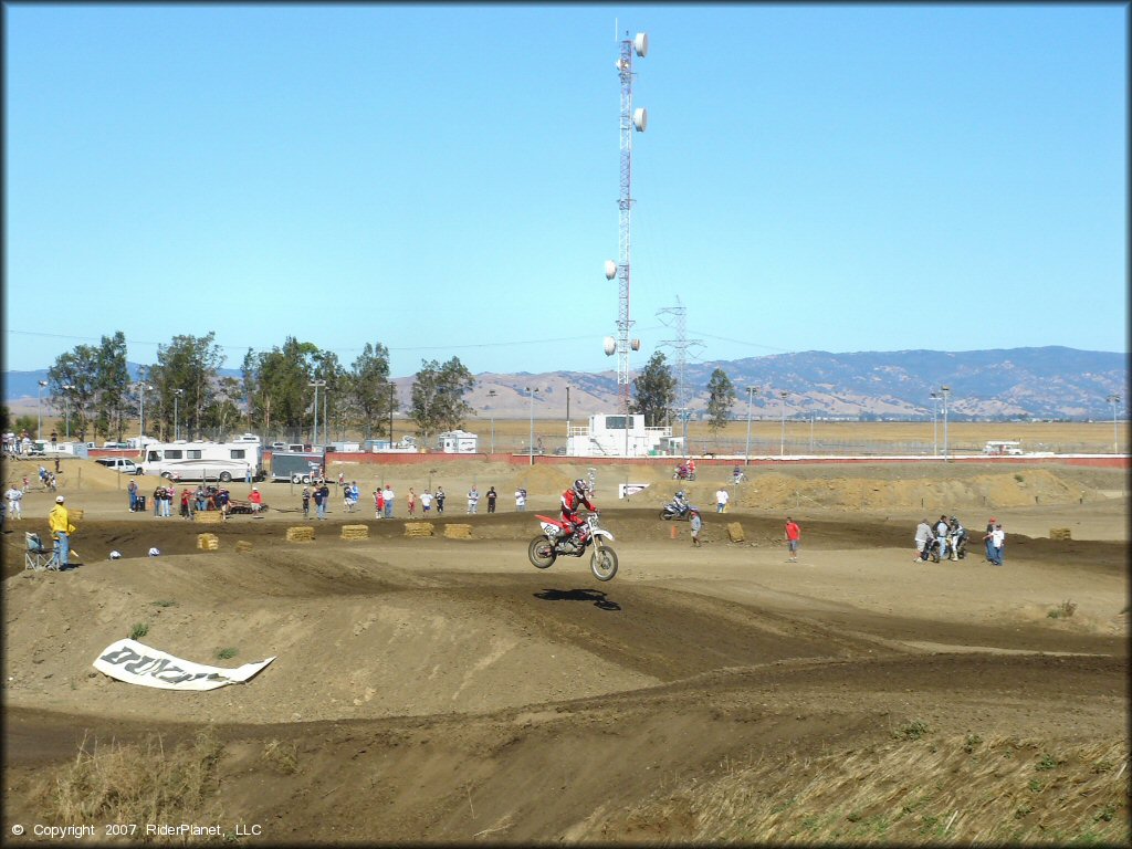Honda CRF Motorbike catching some air at Argyll MX Park Track