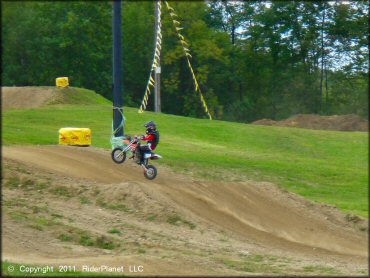 KTM Dirt Bike catching some air at Area 51 Motocross OHV Area