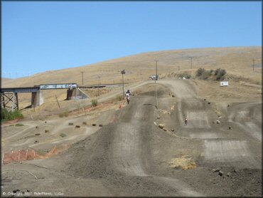 Honda CRF Dirt Bike jumping at Club Moto Track