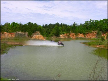 ATV crossing the water at Sand Hill ATV OHV Area