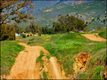 View of a motocross track with some rugged sections.