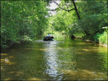 ATV traversing the water at Sandtown Ranch OHV Area