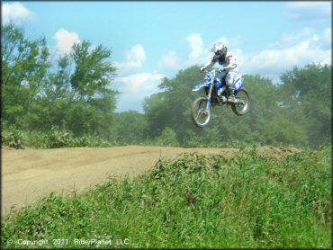 Yamaha YZ Dirt Bike jumping at Connecticut River MX Track