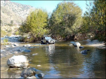 4WD vehicle crossing the water at San Gabriel Canyon OHV Area