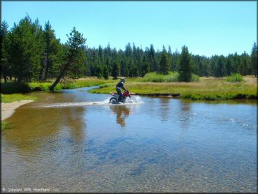 Honda CRF Motorbike in the water at Lower Blue Lake Trail